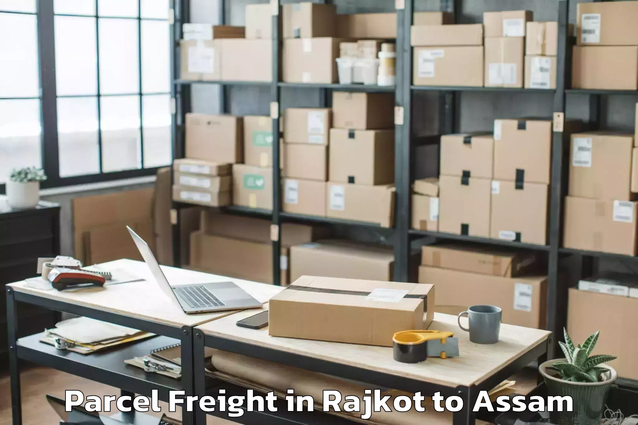 Easy Rajkot to Bokajan Parcel Freight Booking